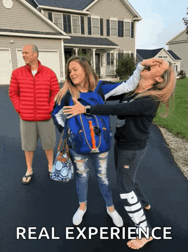 a man in a red jacket stands behind two girls with the words real experience written below them