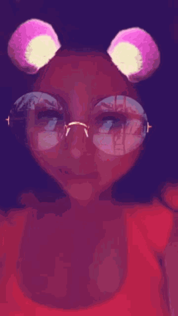 a woman wearing glasses with a reflection of a city in the lenses