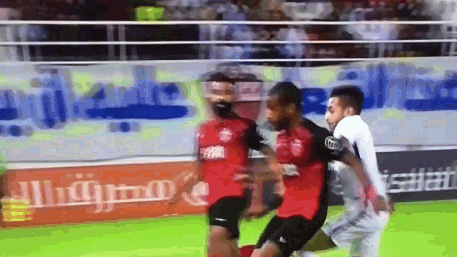 a soccer game is being played in front of a sign that says ' allianz '