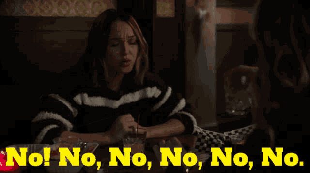 a woman sitting at a table with the words no no no no no in yellow letters