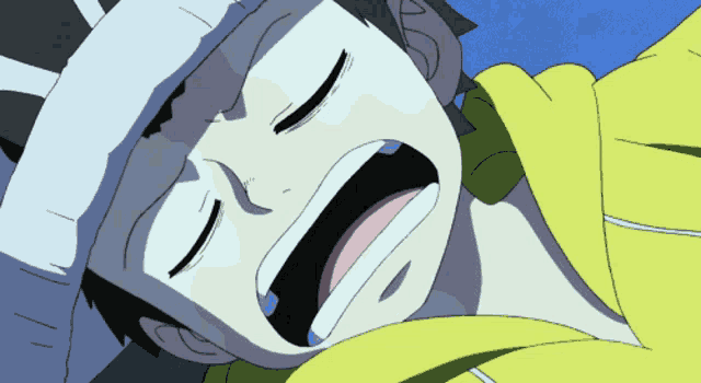 a person with a bandage on their head is laying down