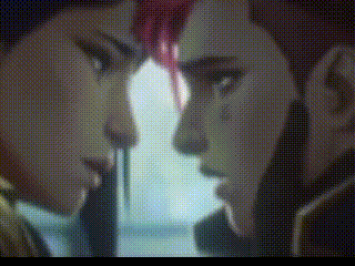 a close up of two people 's faces looking at each other in a blurry photo .