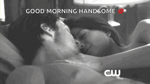 a black and white photo of a man and woman kissing with the words good morning handsome