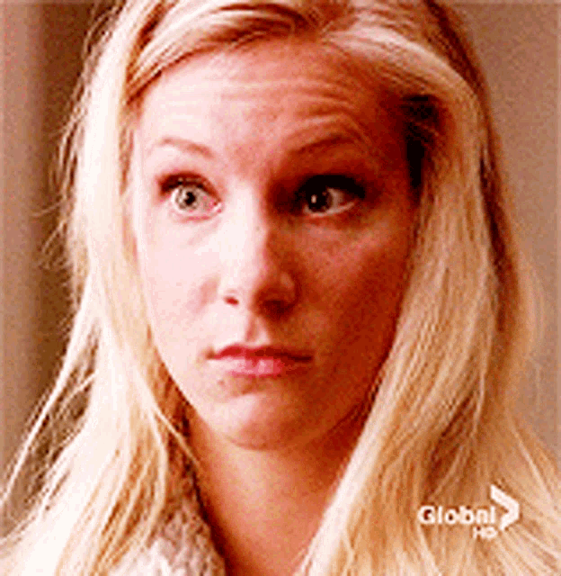 a close up of a blonde woman 's face with the word global on the bottom left