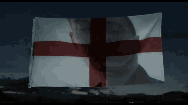 a flag with a man 's face behind it
