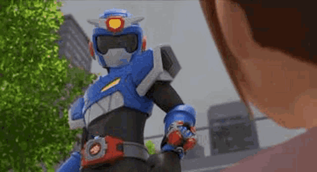 a cartoon robot is standing next to a woman in a red shirt .