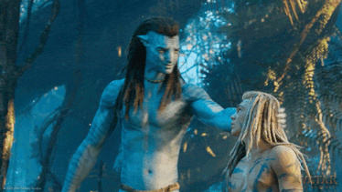 a movie poster for avatar shows a man and woman hugging each other
