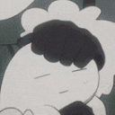 a close up of a cartoon character with his eyes closed and a hand on his head .