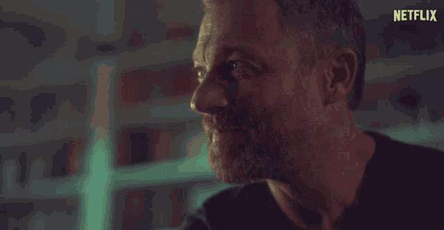 a close up of a man 's face with the word netflix in the corner