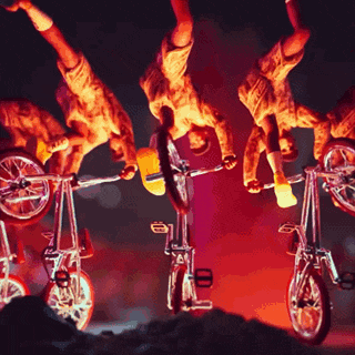 a group of people are doing stunts on bicycles with the letters a and b on them
