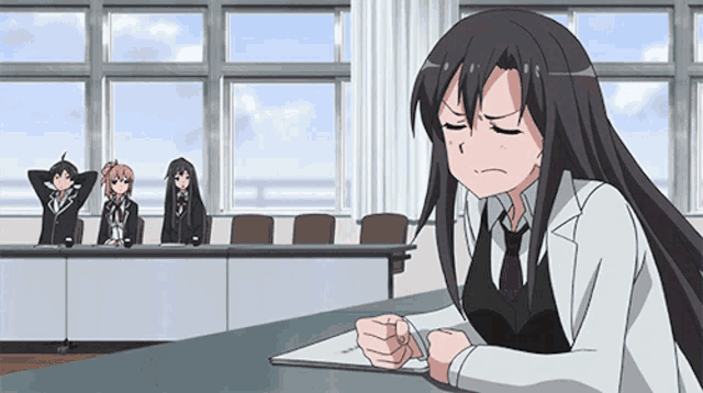 a girl in a white coat and tie sits at a desk