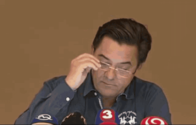 a man wearing a polo shirt with a number 3 on it