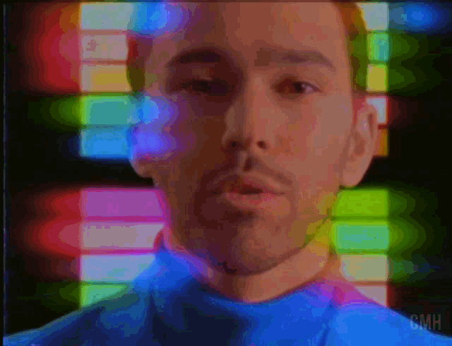 a blurry picture of a man 's face with smh written below it