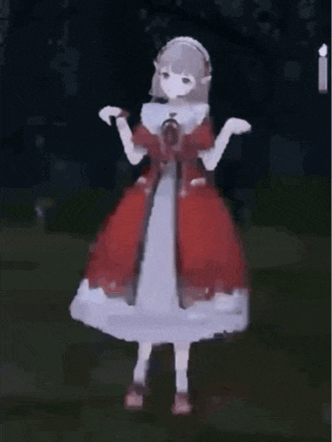 a girl in a red dress is standing in a dark room .