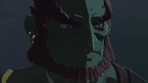 a statue of a man with horns and a beard looks at the camera