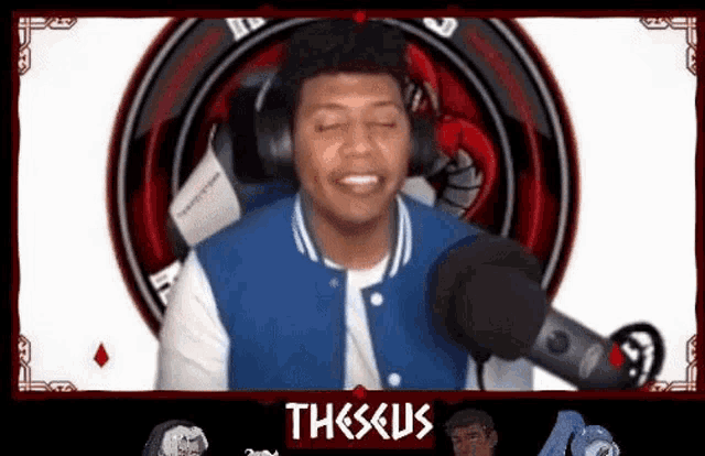 a man wearing headphones is talking into a microphone .