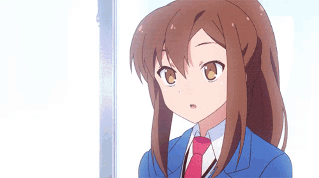 a girl with long brown hair is wearing a blue suit and tie