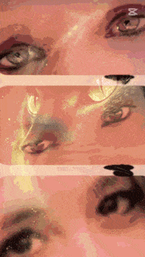 a close up of a woman 's eyes with the letter m on the bottom right