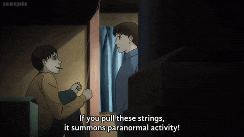 a man says if you pull these strings it summons paranormal activity in a dark room