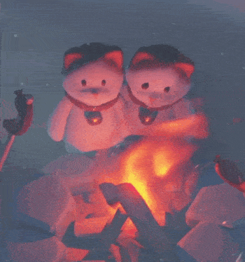 two stuffed animals are sitting by a fire