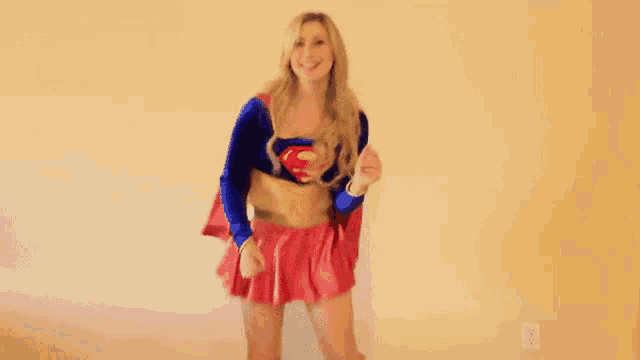 a woman in a superhero costume with her arms outstretched
