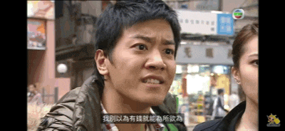 a man and a woman are standing in front of a store with a sign that says ' hong kong ' on it