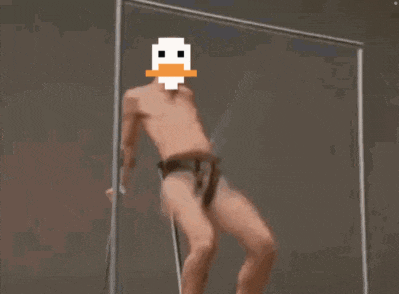 a man without a shirt has a pixelated duck on his face