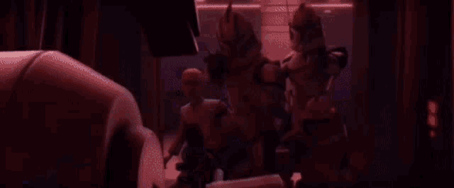 a group of clone trooper soldiers are standing in front of a window .
