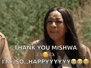 a woman is crying and saying thank you mishwa i 'm so happy .