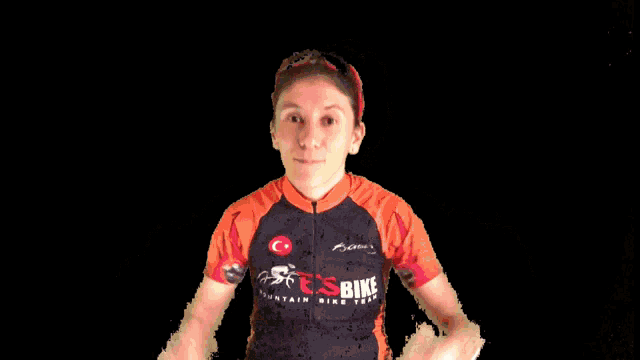 a woman is wearing a shirt that says fesbike on it