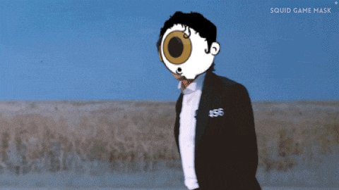 a man in a suit with the number 456 on his sleeve