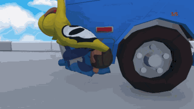 a cartoon character laying on the ground next to a blue truck with the number 5 on the back