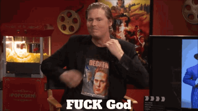 a man wearing a shirt that says " fuck god "