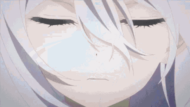 a close up of a girl 's face with white hair and blue eyes .