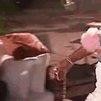 a person is holding a pink cotton candy cone