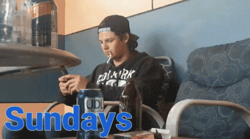 a man smoking a cigarette next to a can of beer and the word sundays
