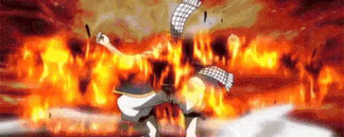 a fairy tail character is standing in front of a fire .