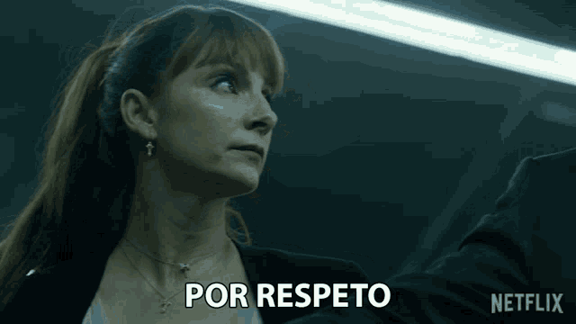 a woman says por respecto in spanish in a dark room