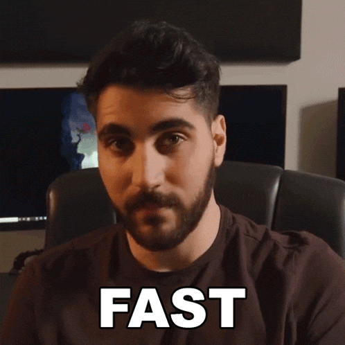a man with a beard is sitting in a chair with the word fast above his head