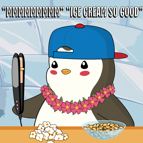 a penguin is holding a hair straightener next to a bowl of popcorn and nuts
