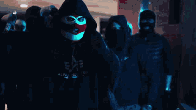 a group of people wearing masks and hoodies with the word afield on it