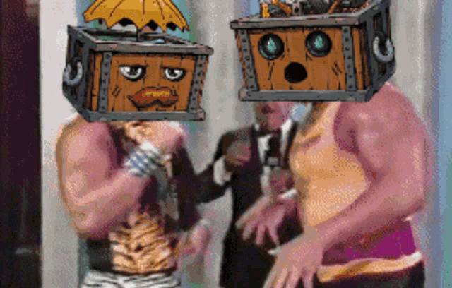 two men wearing boxes on their heads standing next to each other