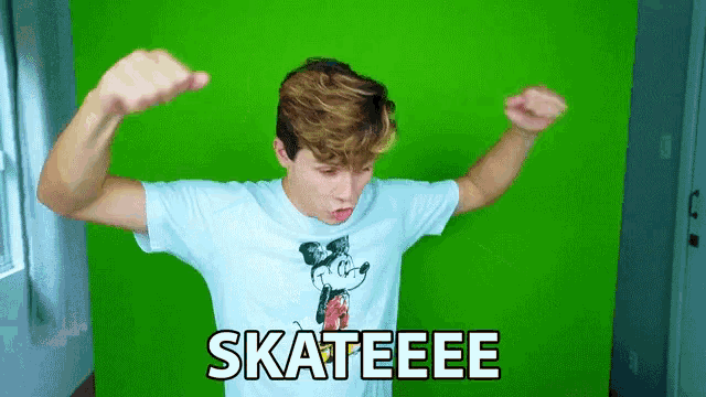 a young man flexes his muscles in front of a green screen that says skateee