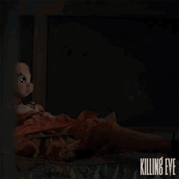 a poster for the movie killing eve shows a woman in a pink pig mask