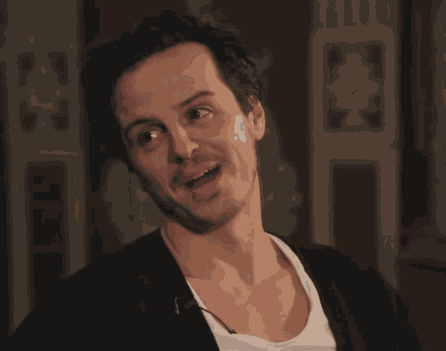 a man is laughing with his mouth open