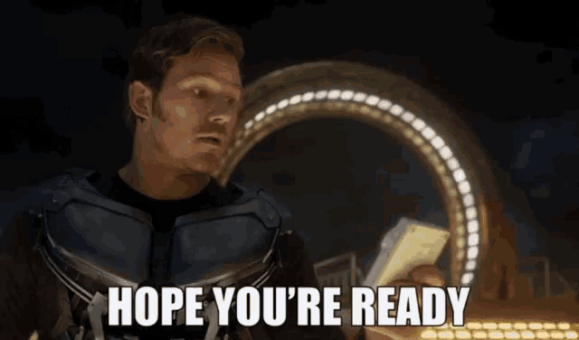 a man is holding a piece of paper and saying hope you 're ready .