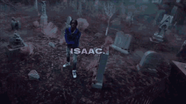 a man standing in a dark forest with the name isaac on the bottom right