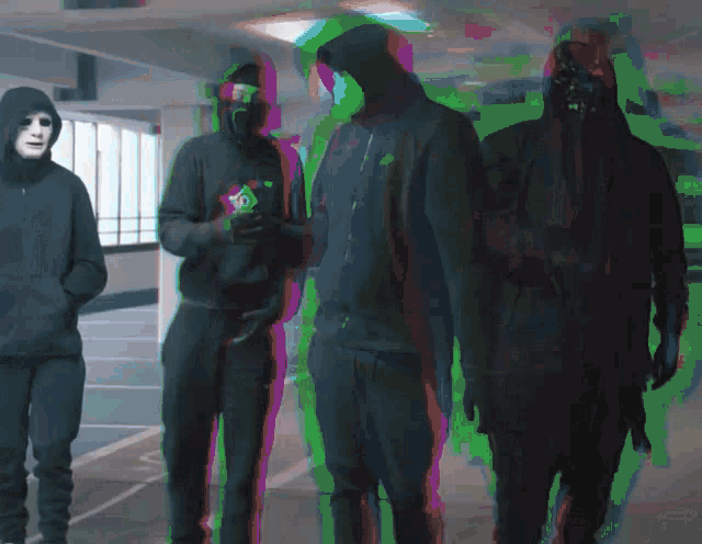 a group of men wearing masks and hoodies are standing together