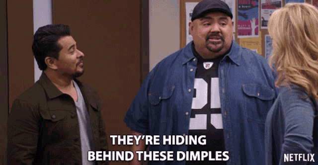 a netflix ad shows two men and a woman and they are hiding behind these dimples