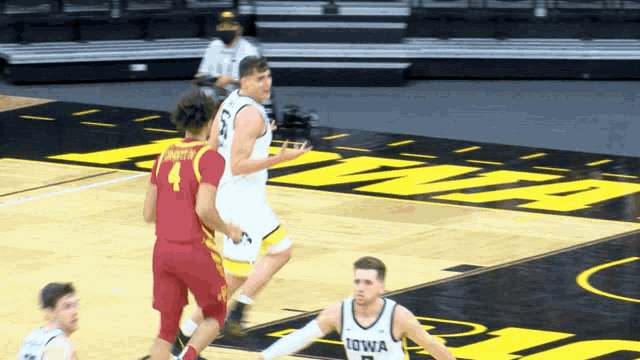 iowa basketball players are playing a game on the court